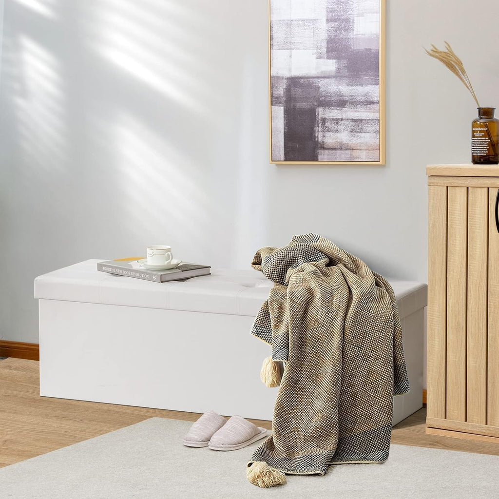 43" folding storage ottoman bench, faux leather storage shown in use