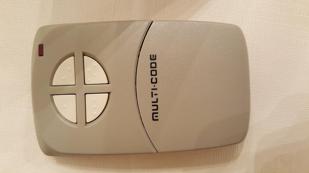 linear mcs414001 model 414001 4-channel visor transmitter, gray shown in use