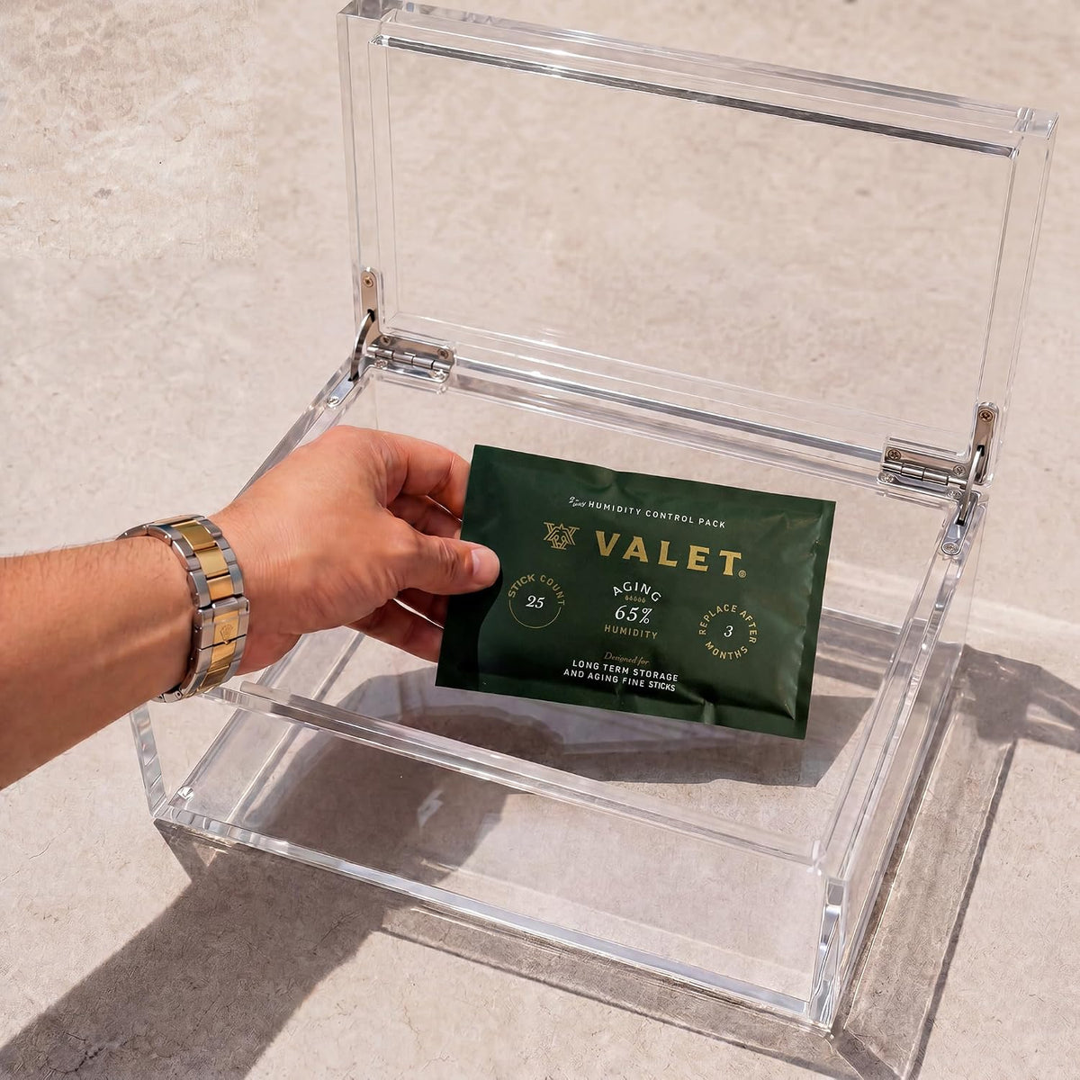valet 65% two-way humidity packs (12-pack) on a desk or shelf