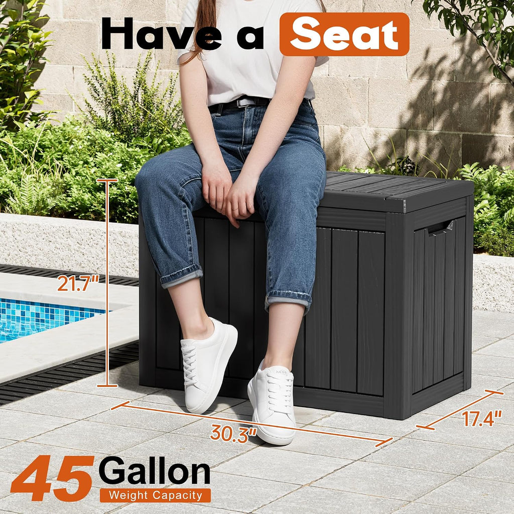 waterproof outdoor storage box, resin patio bin,45 gal,black shown in use