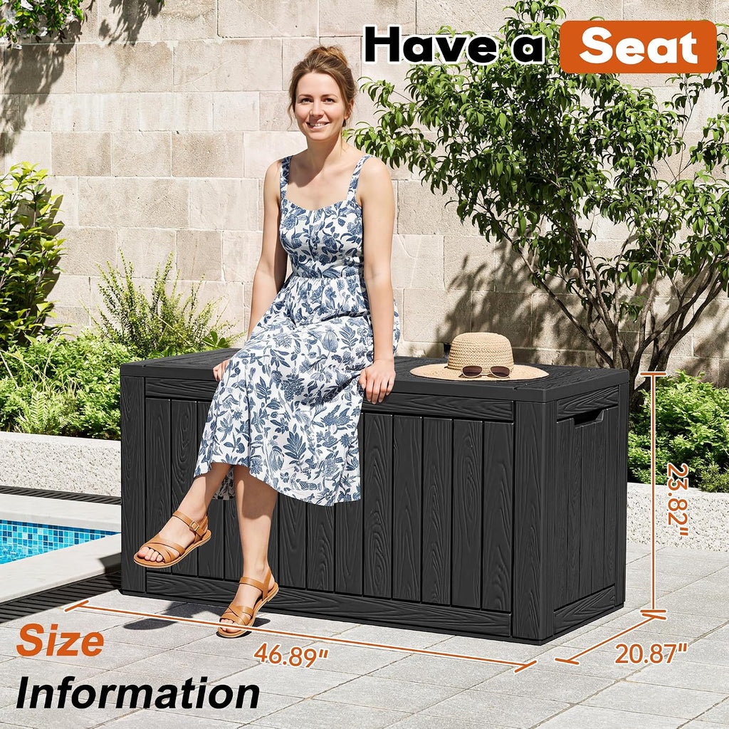 waterproof outdoor storage box, resin patio organizer,120 gal,black shown in use